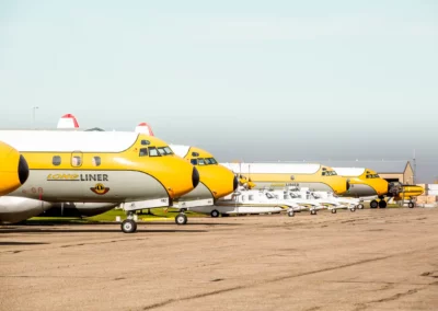 A line of airplanes at the Red Deer Airport