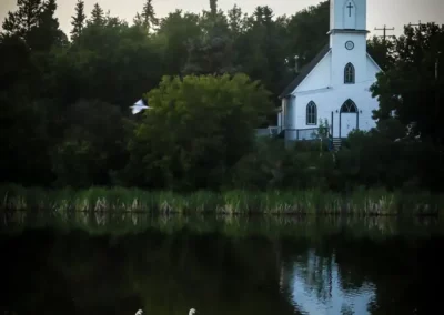 Church over the water at Mirror Lake, Camrose